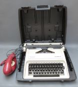 'Genie' telephone TSR 8022A c1980 and an Olympia Carina 2 c1960's typewriter