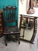 An oak hall chair and similar mirror