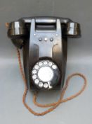A vintage bakelite telephone marked 321L E61/1
