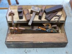A vintage tool chest with various sized block and router planes,