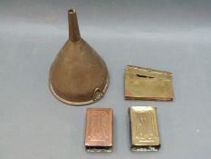 A group of vintage brass items, a trench art book shaped lighter dated 1917,