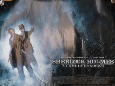 Four cinema advertising film posters to include 'Sherlock Holmes, A Game of Shadows', 'Dark Skies',