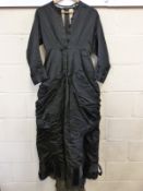 A late Victorian or early Edwardian ladies mourning dress with decorative buttons