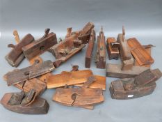 A quantity of vintage woodworking planes to include unusual moulding planes,