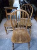 An oak bench and three chairs