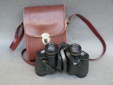 A cased pair of Carl Zeiss Jenoptem 8x30W binoculars