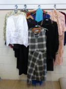 A collection of ladies clothes including dresses, jackets, evening wear and two piece suits,