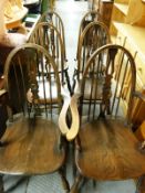 A set of six (4 and 2) elm seated Windsor dining chairs
