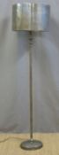 A designer polished steel standard lamp (163cm tall)