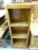 An oak two drawer coffee table/chest, slim oak bookcase,