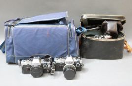 Three Olympus cameras comprising OM10 x 2 and an OM1