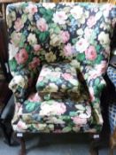 A wingback armchair with floral print