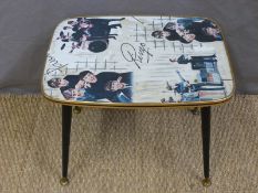 A 1960's retro table with original Beatles print top (H41 x L49 x W37cm)