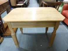 A Heals style oak table with fluted legs,