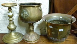 A collection of brass jardinieres including pedestal examples