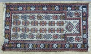 A small Afghan rug (134 x 78cm)
