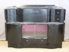 An Art Deco style cocktail cabinet with ebonised finish,