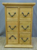A six drawer bedside chest (H64 x W42 x D34cm)