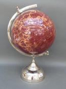A desk globe on stand,