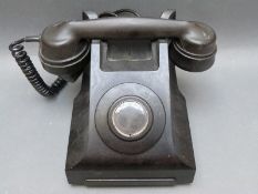 A vintage black bakelite extension telephone marked 332CB