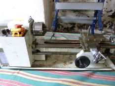 A model engineering or clock maker's lathe with thread cutting function, 3 and 4 jaw chucks, stead,