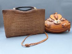 A handbag made from an armadillo together with a vintage alligator skin example