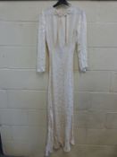 A 1920s evening dress with rosette decoration to neckline