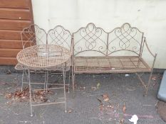A three piece bistro set in weather finish lattice work metal,