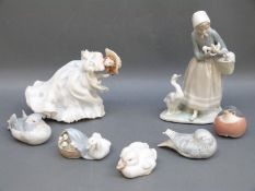 A collection of Lladro and Copenhagen figures