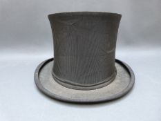 A collapsible top hat by Willoughby,