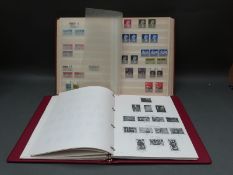 A Stanley Gibbons Great Britain album and a stockbook of GB stamps,