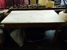 A pine kitchen table (H78 x L151 x W91cm)