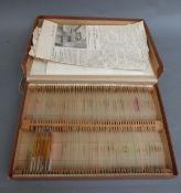A boxed set of glass microscope slides with list of contents catalogued and numbered,