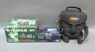 A boxed Fujifilm Finepix 6900 zoom digital camera and a Panasonic DMC-FS33 camera