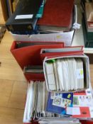 Two boxes of GB first day cover albums, loose stamps,