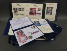 A collection of coin/stamp covers in seven Royal Family Golden Jubilee and Prince William albums