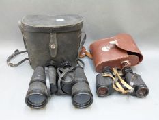 A cased pair of Carl Zeiss Jenoptem 8 x 30 binoculars and a cased pair of Regent 10 x 50 binoculars