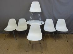 Six Vitra Eames white dining chairs and a Moroso 'Supernatural' table (height 71cm,