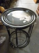 A nest of three tray top tables decorated with owls