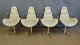 A set of four retro button-back leather chairs with chrome frames