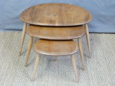 A retro Ercol light elm nest of pebble shaped tables (H41 x L66 x W47cm)