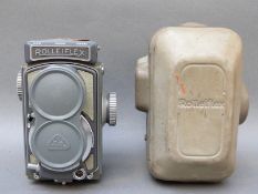A grey Rolleiflex baby model to suit 127 film with original hard case