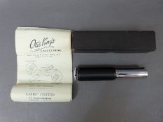 A boxed Otis King spiral slide rule calculator,