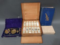 A cased set of microscope slides comprising twelve trays of largely botanical,