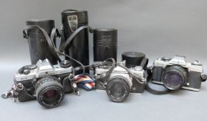 Olympus OM2 SLR camera with 1:1.8 f = 50mm lens, Minolta XG-M, camera with Rokkor 50mm 1:1.