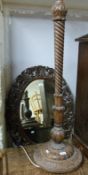 A carved oak lamp and mirror