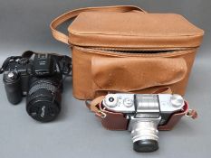 Fujifilm Finepix S9500digital camera and a vintage cased Praktica FX2 SLR with lenses