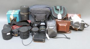 A quantity of cameras and accessories to include Ashi Pentax with 1:3.