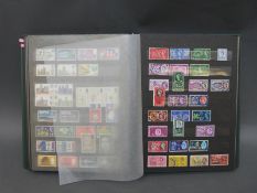 A stockbook containing a collection of GB stamps from 1840 (penny black) to modern