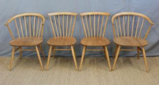 A set of four Ercol light elm chairs including two carvers